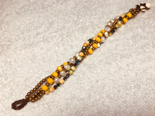 Carica l'immagine nel visualizzatore di Gallery, Bracciale allacciato a 4 fili variante giallo-arancio